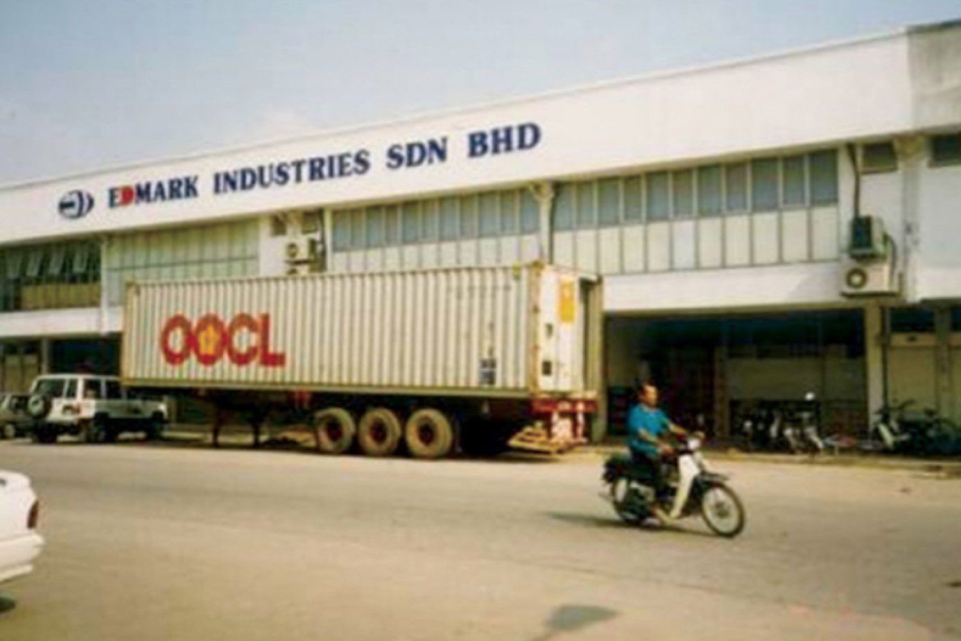 The first Edmark Industries factory in 1989, with a shipping container being loaded