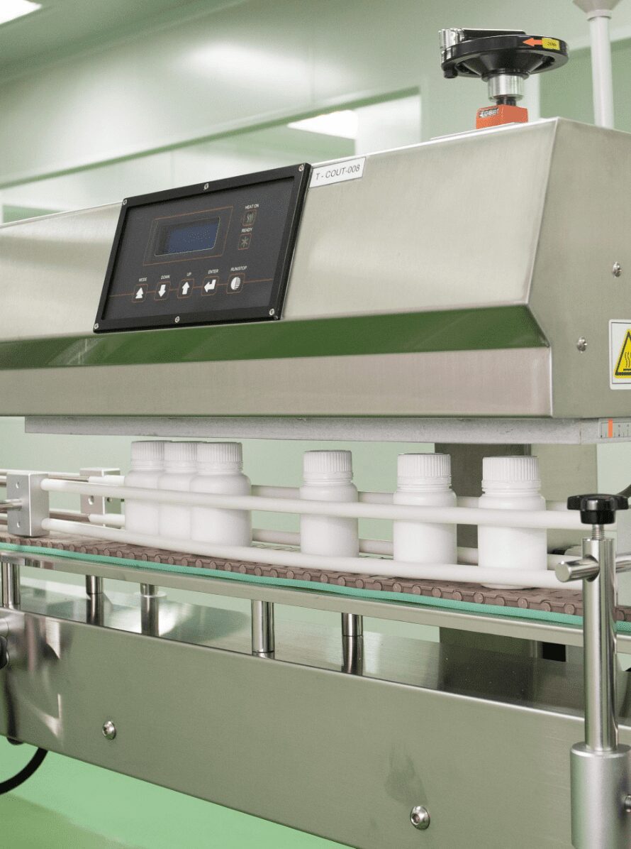 Bottles passing through the metal detector and checkweigher