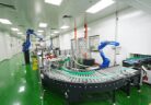 Robotic arms on the curved conveyor of the automated packing line