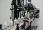 Home care bottles moving through the capping station