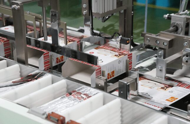 Folded cartons in the cartoning machine magazine