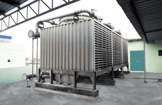 Water-cooled cooling tower serving the HVAC chiller system at the Edmark Industries factory