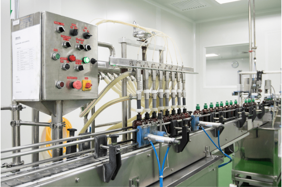 Automatic liquid filling line with control panel in B Block
