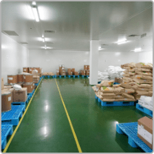Raw material sacks stored on pallets in the Edmark Industries warehouse