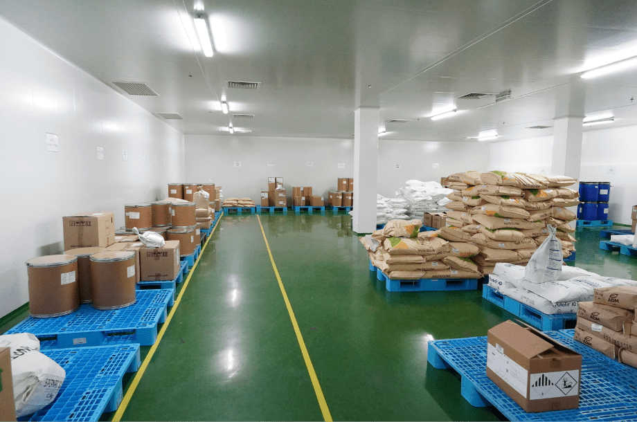 Raw material sacks stored on pallets in the Edmark Industries warehouse