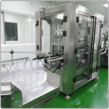 Bottles moving through the automated filling and capping line