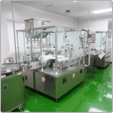Enclosed automatic filling machine on the Edmark Industries production line