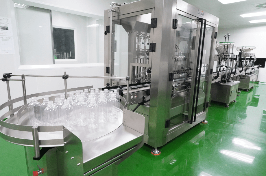 Bottles moving through the automated filling and capping line