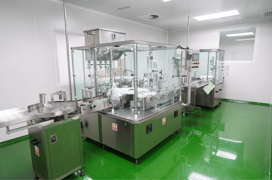 Enclosed automatic filling machine on the Edmark Industries production line