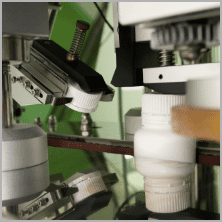 Bottles passing through the metal detector and checkweigher