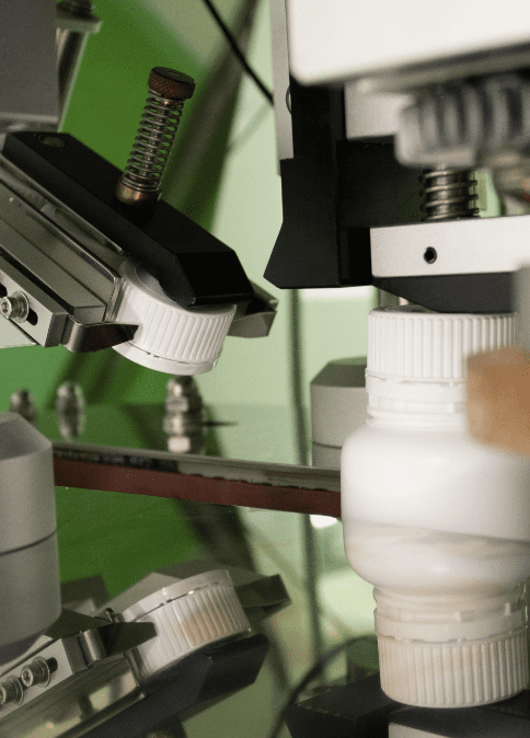 Bottles passing through the metal detector and checkweigher