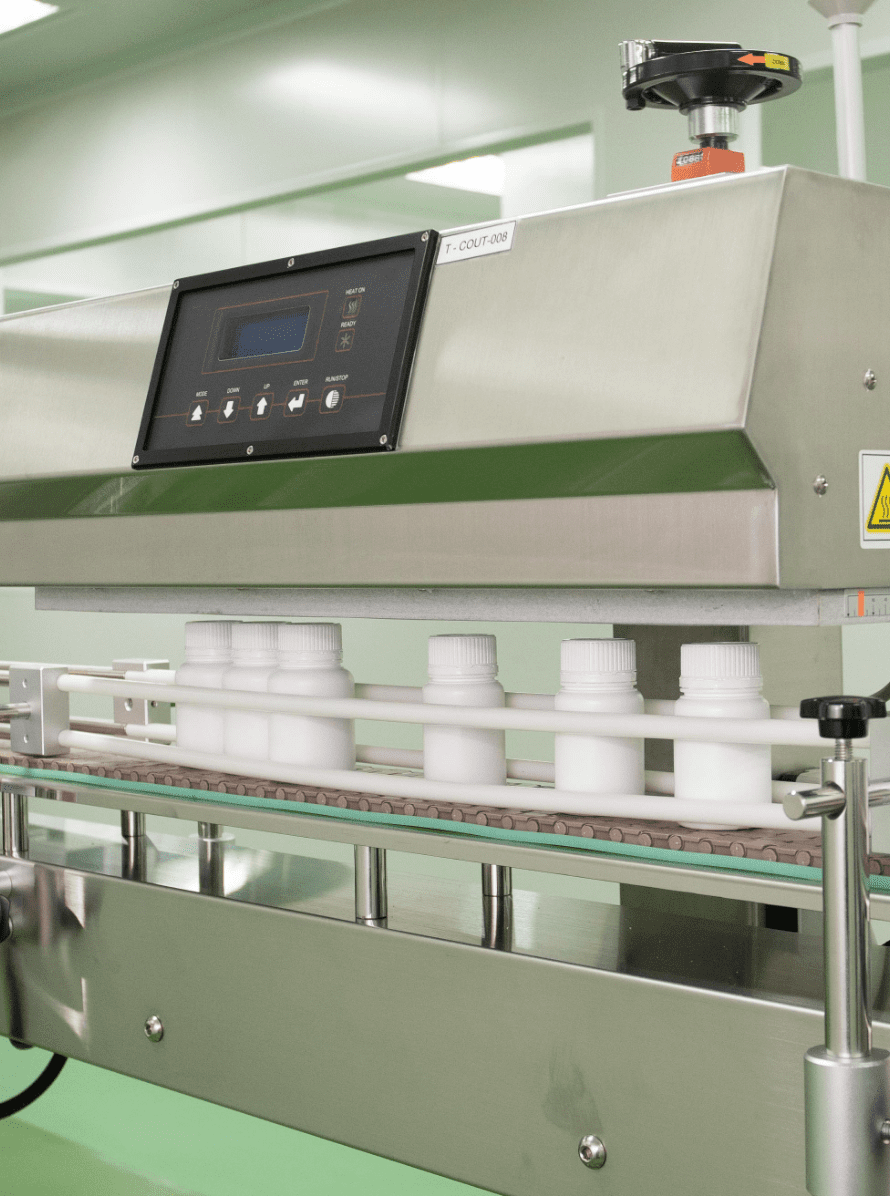 Bottles passing through the metal detector and checkweigher