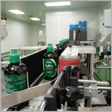 Finished bottles of Splina liquid chlorophyll on the production line