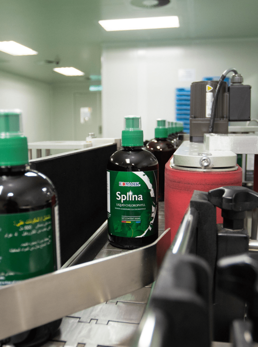 Finished bottles of Splina liquid chlorophyll on the production line