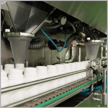 Automatic filling machine dosing product into white containers