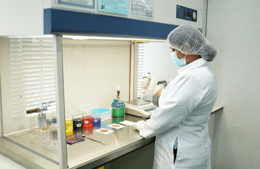 Laboratory technician preparing samples at the fume hood