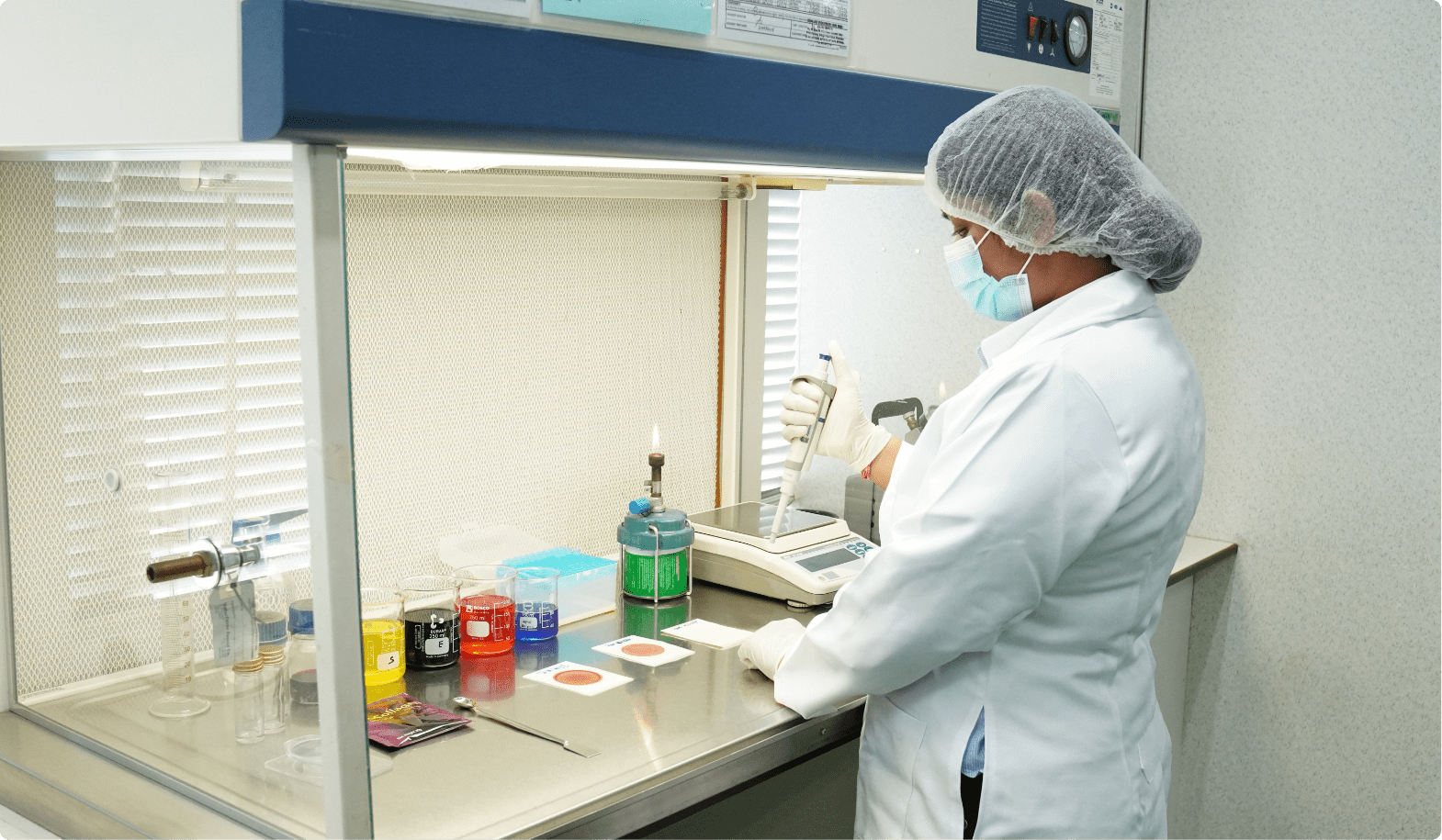 Laboratory technician preparing samples at the fume hood