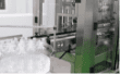 Personal care bottles on the automated filling line at Edmark Industries