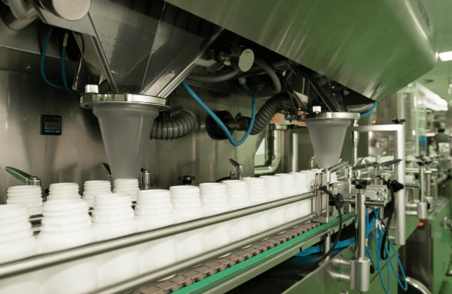 Powder dosing funnels filling supplement canisters