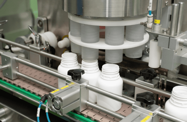 Rotary machine feeding supplement jars on the filling line