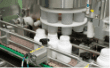 Rotary machine feeding supplement jars on the filling line