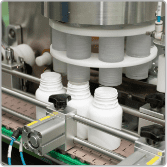 Rotary machine feeding supplement jars on the filling line