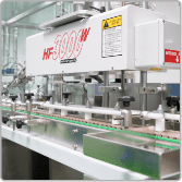 HF-300W automatic sealing machine on a food and beverage packaging line