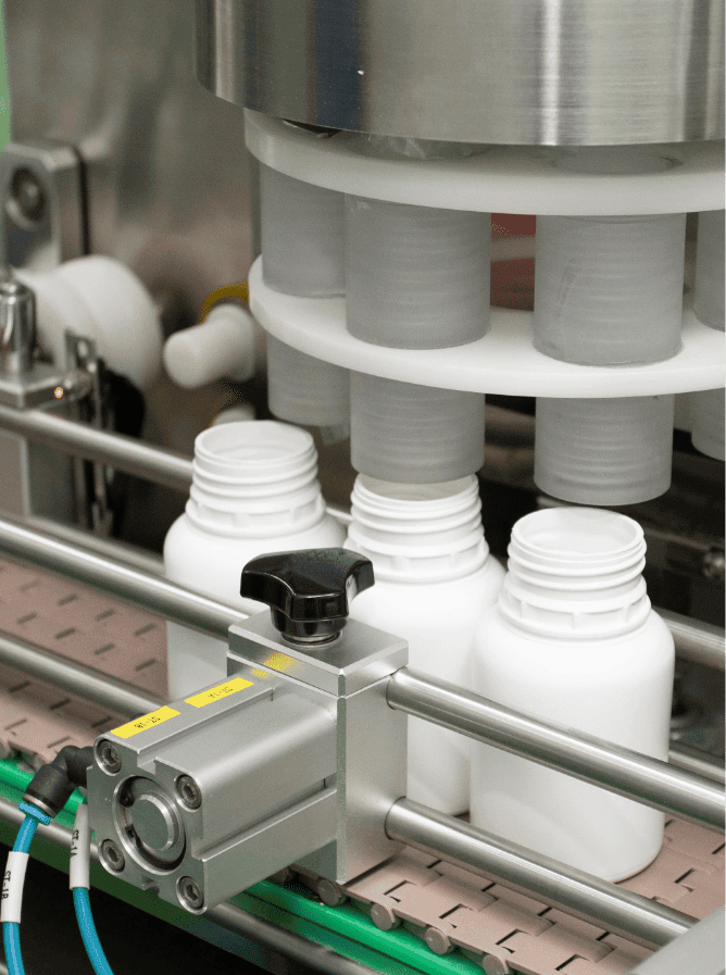 Rotary machine feeding supplement jars on the filling line