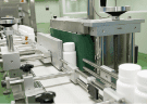 Supplement bottles on the automated filling and packing line