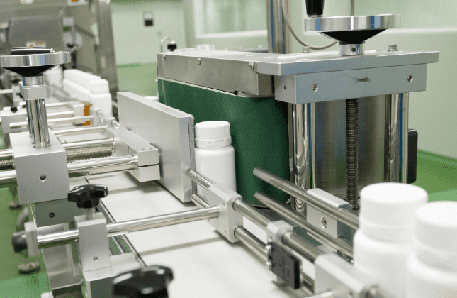 Supplement bottles on the automated filling and packing line