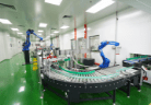 Robotic arms on the curved conveyor of the automated packing line
