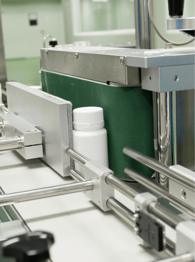 Supplement bottles on the automated filling and packing line