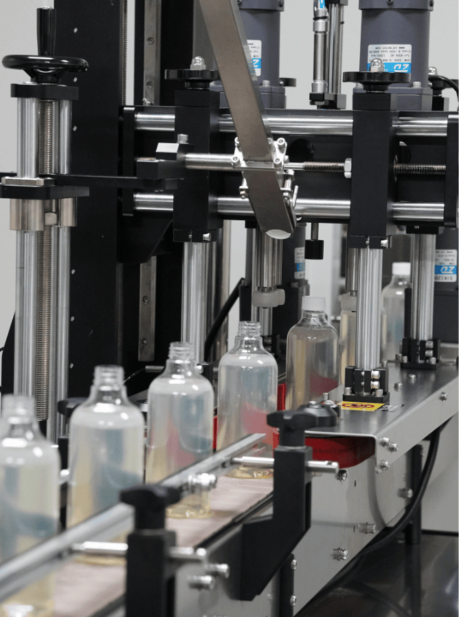 Home care bottles moving through the capping station