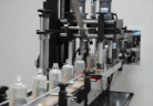 Home care bottles moving through the capping station