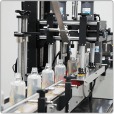 Home care bottles moving through the capping station