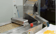 Softgel capsules on the discharge chute of the encapsulation machine