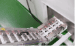 Sachet strips on the transfer conveyor to cartoning