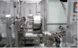 Transfer chain feeding the cartoning machine