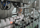 Capsule counting machine dosing capsules into bottles