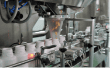 Capsule counting machine dosing capsules into bottles