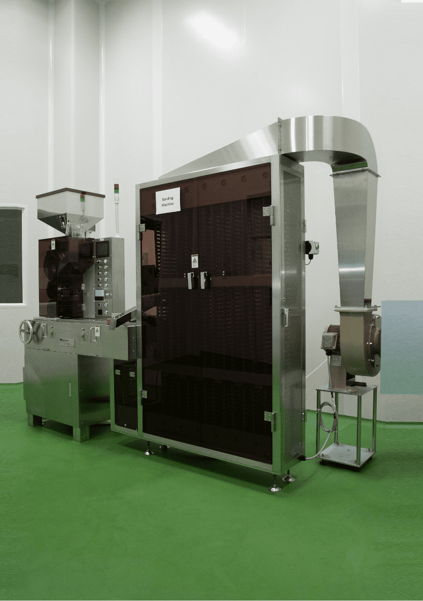 Automated capsule and liquid filling machine at Edmark Industries facility