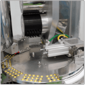 Capsule feeding and orientation unit at Edmark Industries