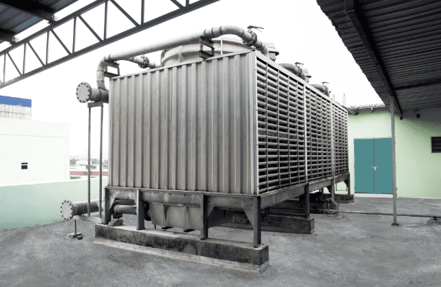 Water-cooled cooling tower serving the HVAC chiller system at the Edmark Industries factory