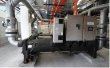 Water-cooled chiller unit and control panel in the Edmark Industries plant room